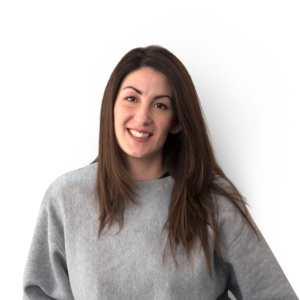 Young lady with long straight black hair over the shoulders and light grey jumper